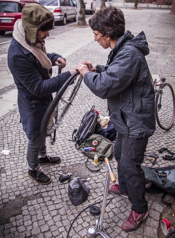 Graham from BikeSurf repairing bikes on the street