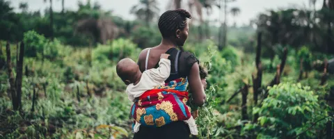 Woman Carrying Baby