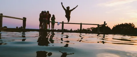 Person Jumping into a Lake