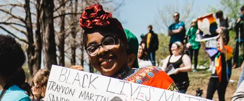 Woman holding a Black Lives Matter Sign