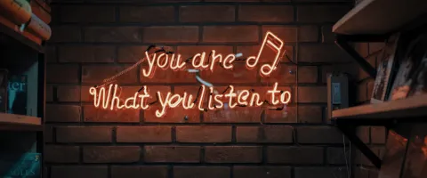 sign on the wall "you are what you listen to"
