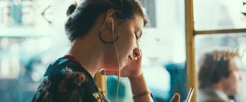 Woman listening to Podcast
