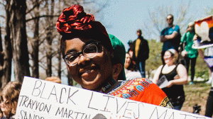 Woman holding a Black Lives Matter Sign