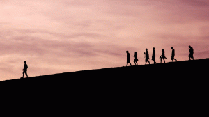 People walking down a hill