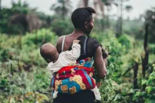Woman Carrying Baby