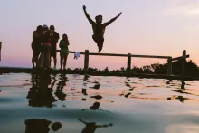 Person Jumping into a Lake