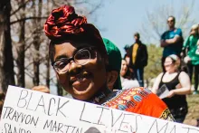 Woman holding a Black Lives Matter Sign