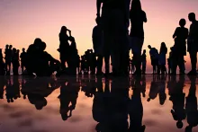 People standing together during sunset