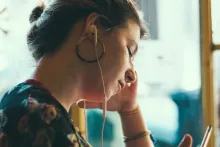 Woman listening to Podcast